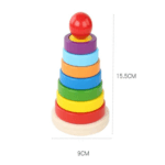 Tour Arc-en-Ciel jouet en bois d'empilement (Rainbow Tower) empilé, montrant sept anneaux de couleur arc-en-ciel, une petite pièce carrée et une boule rouge sur une base en bois clair. Les dimensions du jouet sont indiquées : 15,5 cm de hauteur et 9 cm de diamètre.