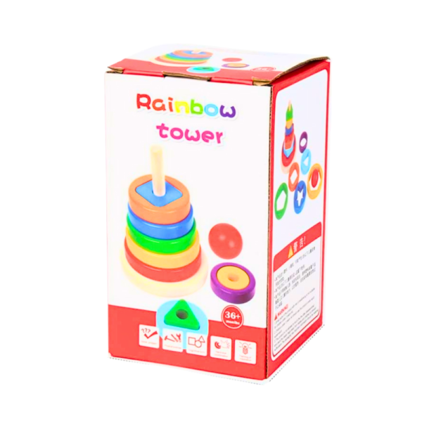 Tour-Arc-en-Ciel , boîte d'emballage en carton du jouet d'empilement "Rainbow Tower". La boîte est principalement blanche et rouge, avec le nom du produit en couleurs arc-en-ciel et des illustrations du jouet.