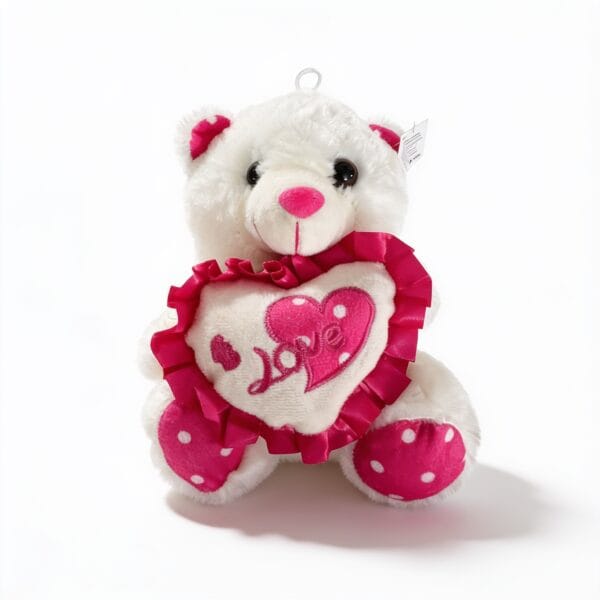 peluche nounours blanc en forme d'ours avec coussin cœur texte Love et volants rose à pois blancs, peluche décorative ou cadeau, disponible sur BrefShop.ma